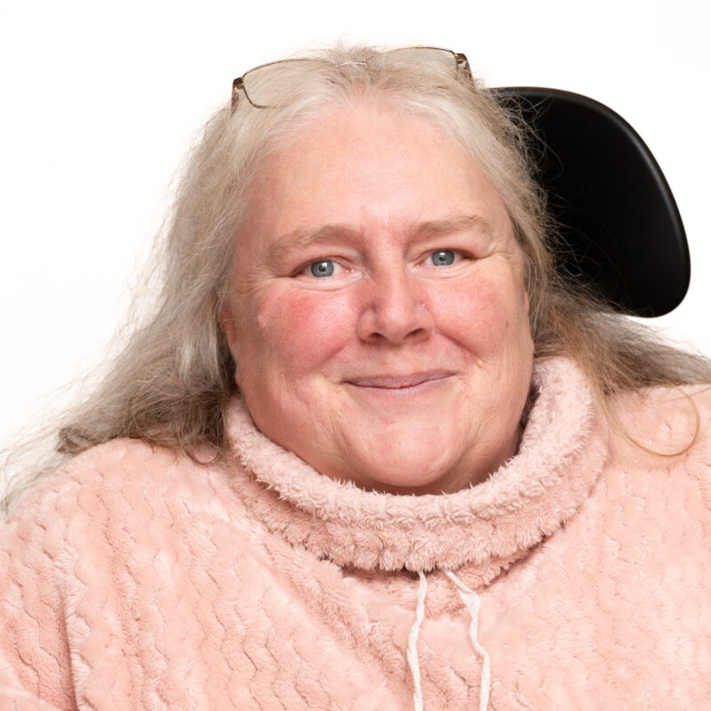 Woman with grey hair and blue eyes