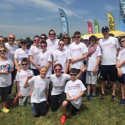 Image of a group of Ruils supporters of various ages at the beginning of the colour run challenge event.