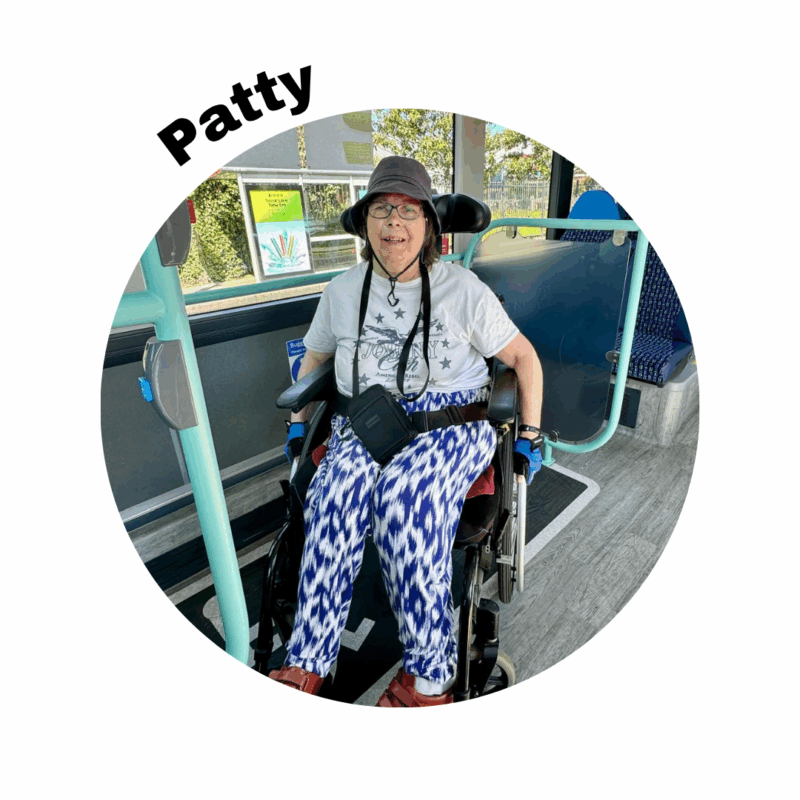 Image of volunteer patty sitting in her wheelchair on a bus - her name is above the photo in a round frame