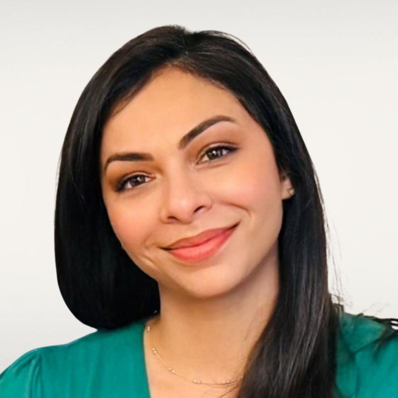 Woman with long dark hair & brown eyes.